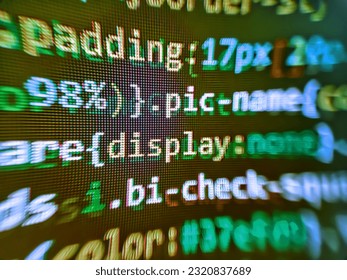PHP development, software site code. Freeware open source project. Digital binary data on computer screen. Modern tech. Web development code: CSSSASS styles preprocessor script lines