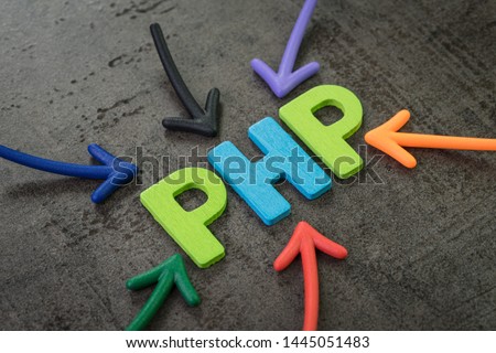 PHP modern programming language for software development or application concept, multi color arrows pointing to the word PHP at the center of black cement chalkboard wall.