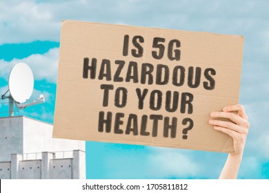 The phrase " Is 5G hazardous to your health? " on a banner in hand. Human holds a cardboard with an inscription. Communication tower. Radio waves impact on human. Airwaves. Healthcare. Pandemic