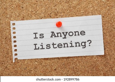 The Phrase Is Anyone Listening Typed On A Paper Note Pinned To A Cork Notice Board. Is Your Message Or Cry For Help Being Heard? What Can You Do To Put Across Your Product Or Message?