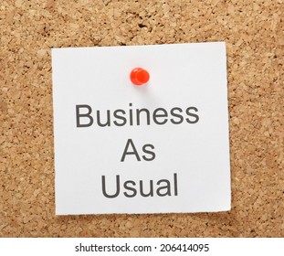 The Phrase Business As Usual Typed On A Piece Of Note Paper And Pinned To A Cork Notice Board