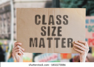 The phrase " Class size matter " on a banner in men's hand with blurred background. Education. Occupation. Teaching. Teachers. School. College. Student. Studying. Profession. Salary