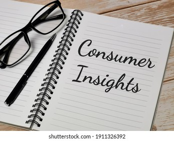 Phrase Consumer Insights Written On Notebook With Pen And Eye Glasses. Big Data Concept.