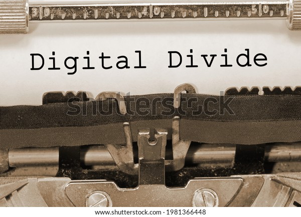 Phrase Digital Divide writen with an old\
vintage typewriter