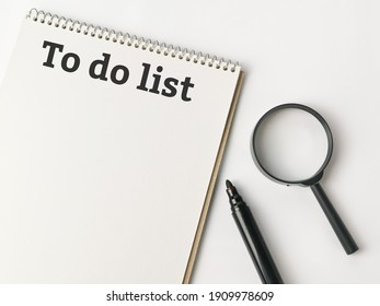 Phrase To do list written on note book with marker pen and magnifying glass. - Powered by Shutterstock