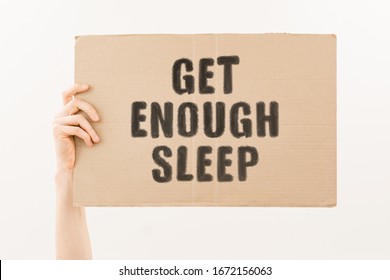 The phrase " Get Enough Sleep " on a banner in hand. Human holds a cardboard with an inscription. Healthcare. Medicine. Balance. Life. Rest. Night time. Relax. Problem. Stress. Routine. Morning - Shutterstock ID 1672156063