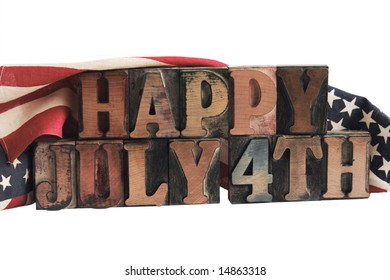 the phrase 'happy July 4th' in ink-stained letterpress type with flags draped behind