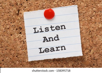 The Phrase Listen And Learn  Typed Onto A Scrap Of Lined Paper And Pinned To A Cork Notice Board. This Is The Key To Success In Education And Learning New Skills For The Workplace.