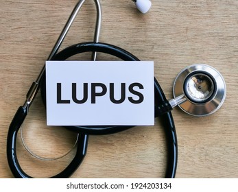 Phrase LUPUS Written On White Card With Stethoscope. Medical And Health Concept.