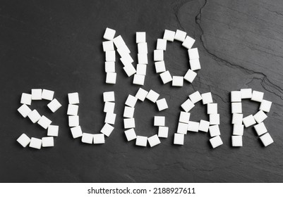 Phrase No Sugar Made Of Refined Cubes On Black Table, Flat Lay