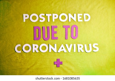 Phrase "Postponed Due To Coronavirus" in Paper/Cardboard Letters