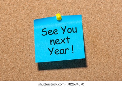 Phrase See You Next Year Pinned At Cork Board