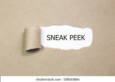 The phrase Sneak Peek appearing behind torn paper. - Shutterstock ID 538565866