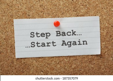 The Phrase Step Back And Start Again Typed On A Paper Note And Pinned To A Cork Notice Board. Sometimes In Business And In Life We Have To Take A Step Back And Change Direction.