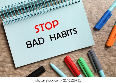 Phrase Stop Bad Habits In Notebook And Pens On Wooden Table, Flat Lay