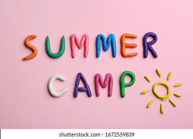 Phrase SUMMER CAMP Made Of Colorful Clay On Pink Background, Flat Lay