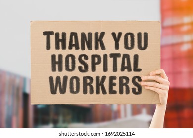 The phrase " Thank you hospital workers " on a banner in hand. Human holds a cardboard with an inscription. Gratitude to healthcare staff. Heroes. People who saves lives. Thankfulness. Life