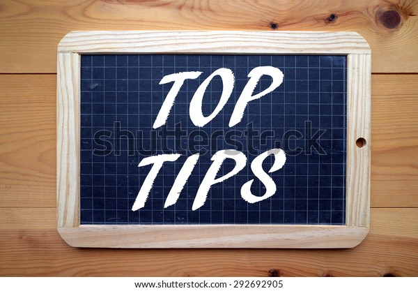 The\
phrase Top Tips in white text on a slate\
blackboard