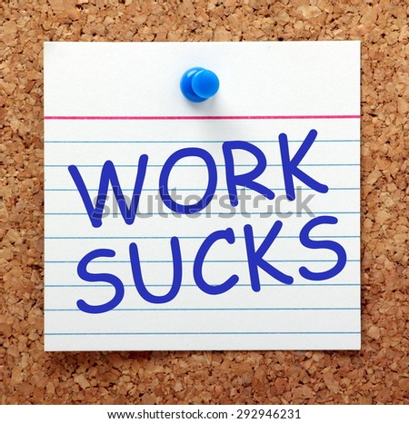 The phrase Work Sucks in blue text on an index card pinned to a cork notice board