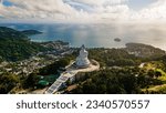 Phuket Big Buddha statue. afternoon light sky and blue ocean are on the back of white Phuket big Buddha is the one of landmarks on Phuket island Thailand.