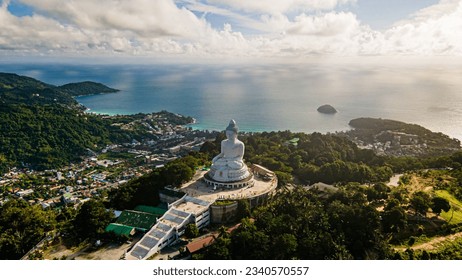 Phuket Big Buddha statue. afternoon light sky and blue ocean are on the back of white Phuket big Buddha is the one of landmarks on Phuket island Thailand. - Powered by Shutterstock