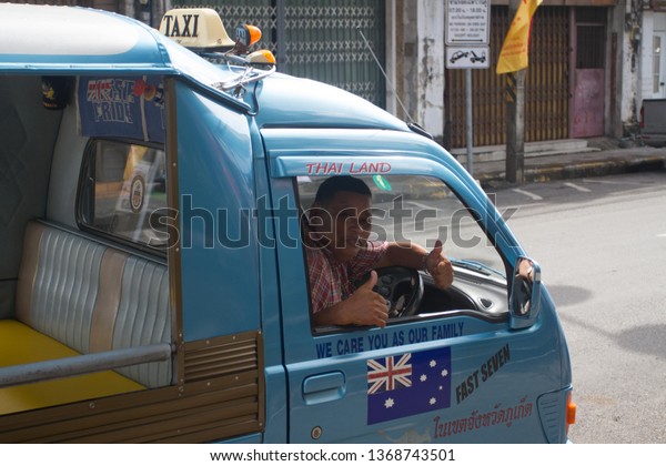 Phuket, Phuket/ Thailand - 10/03/2015: happy tuk\
tuk taxi driver