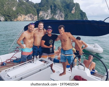 Phuket, Thailand, 11, March, 2019: Dream Yacht Charter Employee Helps Tourists Fix Problems On A Charter Boat