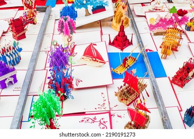 Phuket, Thailand - 25 February 2018: Paper Sculptures Sold On Street Market. Cardboard Popup Sale. Various Toy Papercraft In Kirigami Style