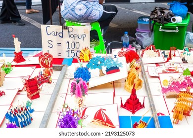 Phuket, Thailand - 25 February 2018: Paper Sculptures Sold In Street Market. Colorful Cardboard Popup Sale. Variety Toy Papercraft In Kirigami Style