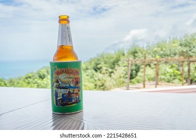 PHUKET, THAILAND - AUGUST 7 2022: A Photo Of A Beer Bottle In A Foam Cooler, Known Locally As A Beer Condom. They Are Popular In The Countries Of East Asia.  