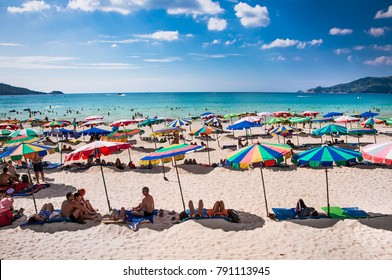 PHUKET, THAILAND- JAN 23, 2016: Crowds of tourists at Patong beach on  Jan 23, 2016 in Phuket, Thailand. Phuket is a popular destination famous for its beaches.