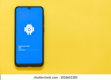 Phuket, Thailand -  July 3, 2020 : close up Samsung Galaxy A50 device in process of Android software installing system update, Android is a mobile operating system developed by Google