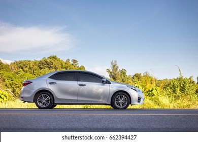 PHUKET, THAILAND - JUNE 16 : Toyota Corolla Altis parking on the asphalt road in Phuket on June 16, 2017. The official dealer of Toyota, who is the top market share for commercial car