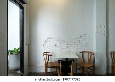 PHUKET, THAILAND- JUNE 22, 2021: Interior architecture design and decoration at 'ROOF PUDDING AND CAFE' local coffee shop and bakery bar decorated with indoor plants and white structure