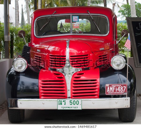 Phuket, Thailand - June\
4th 2912: Classic American Dodge truck and US flag. The vehicle has\
been restored.