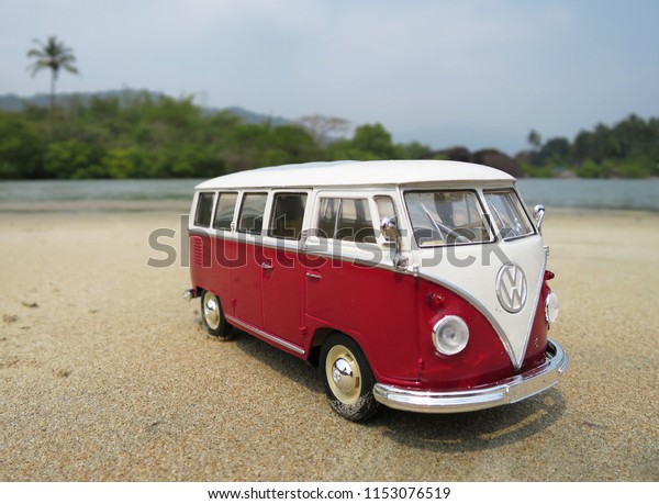 PHUKET, THAILAND -\
MARCH 27, 2015: Miniature VW Bulli 1962 on the beach. The cult car\
of the Hippie generation and it remained the status vehicle of the\
high wave surfers.