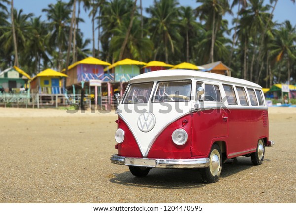 PHUKET, THAILAND - MARCH\
27, 2015: Miniature VW Bulli 1962 on the beach. The cult car of the\
Hippie generation and it remained the status vehicle of the high\
wave surfers