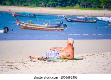 Phuket Thailand March 9 2019, Public Activities On The Beach,Old Man Sunbathing At The Beach