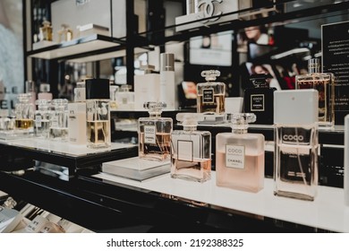 PHUKET, THAILAND - MAY 29, 2022: A Rows Of Chanel Brand Perfumes In A Case On The Supermarket Showcase