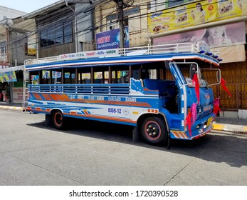 Phuket Town, Thailand - October 16, 2014: One local blue wooden public local bus that services foreign tourists, running between Kata beach, Karon beach and Phuket city downtown.