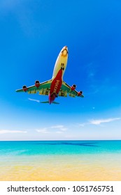 Phuket,Thailand -  March 11, 2017: Plane Landing Of Rossiya Airlines At The Airport, Weeds Over The Sea