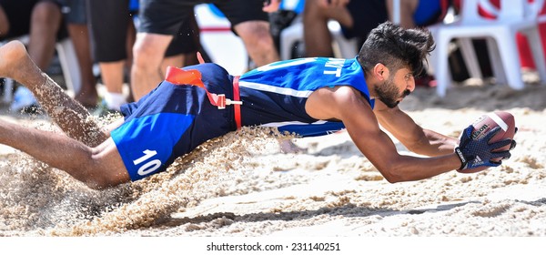 PHUKET,THAILAND-NOV14:Abdullah Dawoud Of Kuwait In Action During The Beach Flag Football Kuwait And Thailand During The 2014 Asian Beach Games At Saphan Hin On NOVEMBER14,2014 In Thailand.