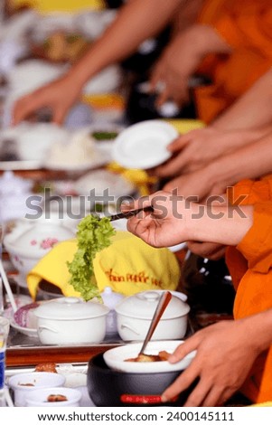 Phuoc Hue buddhist pagoda.  Monks at buddhist ceremony in the main  hall. Vegetarian meal.  Vietnam. 