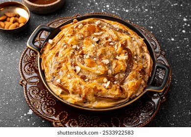 Phyllo pastry pie with pear, gorgonzola cheese, almond and honey close up. High quality photo - Powered by Shutterstock