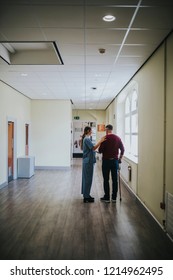 Physiatrist Training A Patient To Walk Again