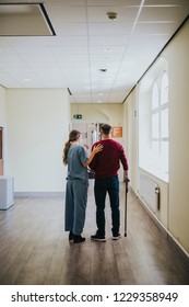 Physiatrist Training A Patient To Walk Again