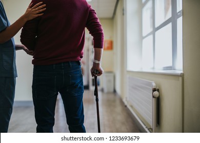 Physiatrist Training A Patient To Walk Again