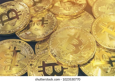 Physical Bitcoin pile background. Cryptocurrency trading concept.