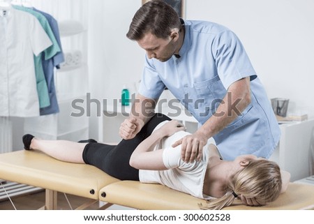 Physical therapist doing mobilisation of the spine