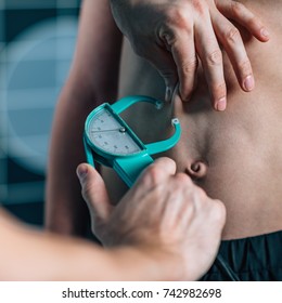 Physical Therapist Doing Skinfold Thickness Measurement